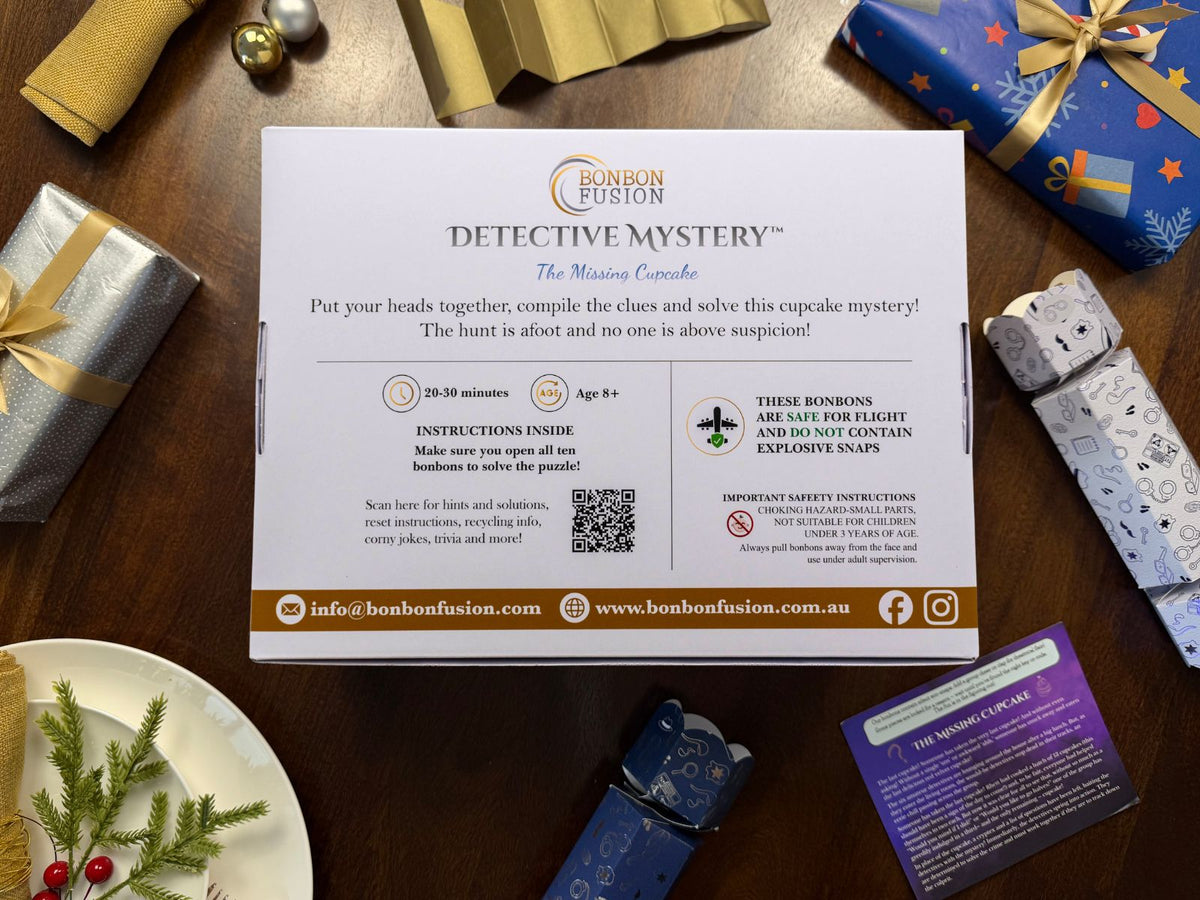 Back of the Bonbon Fusion The Missing Cupcake Detective Mystery box: open all ten bonbons to solve the cupcake mystery. Suitable for ages 8+, takes 20-30 minutes, safe for flights with no explosive snaps, with a QR code for hints and solutions