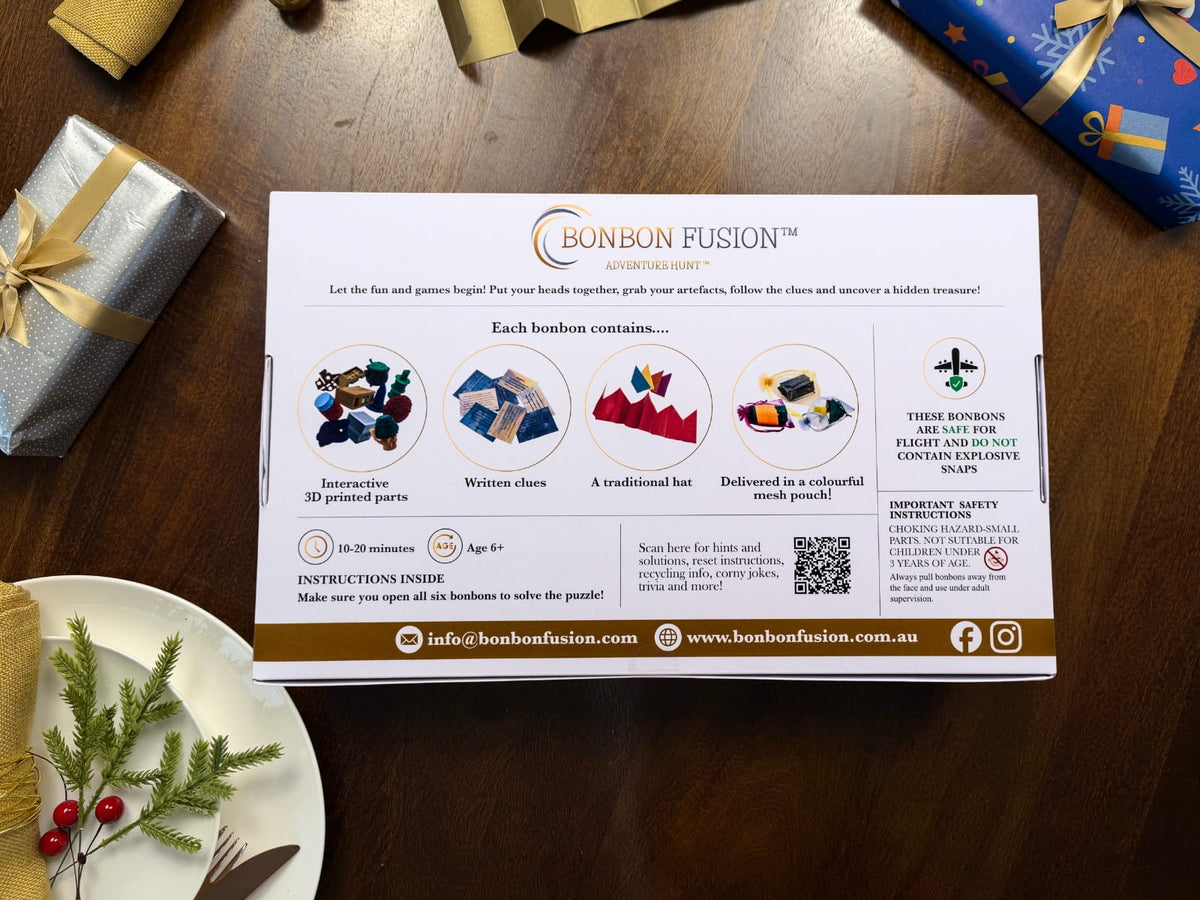 Back of a Bonbon Fusion Adventure Hunt box showing puzzle pieces, written clues, paper hats and mesh pouches, with ages 6+, 10–20 minute play time, safety information and a QR code for hints and instructions.

